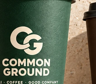 Macro photograph of the Common Ground cup lettering and paper texture